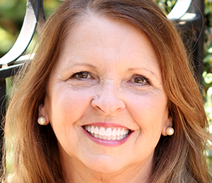 Renee after Renee's smiling portrait after dental treatment