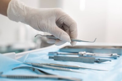Dentist holding dental tools for treatment