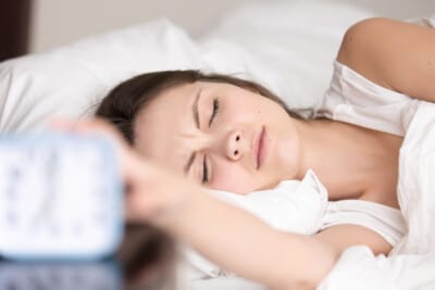 Woman sleeping on her side with eyes closed