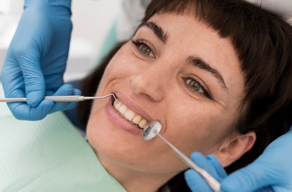 Female patient at the dentist, smiling