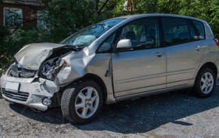 A car that has been in an accident, with the front destroyed