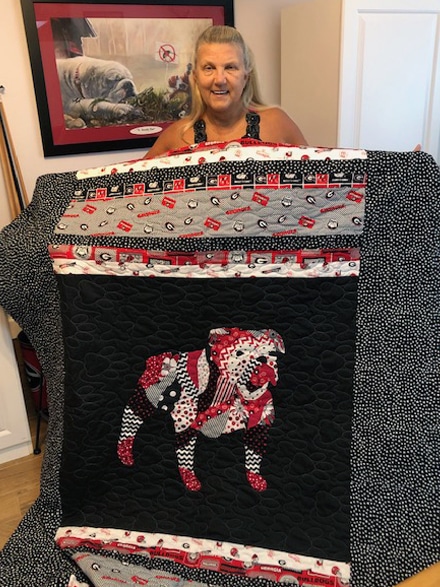 Featured Patient: Raine Harper shows off a beautiful quilt she made